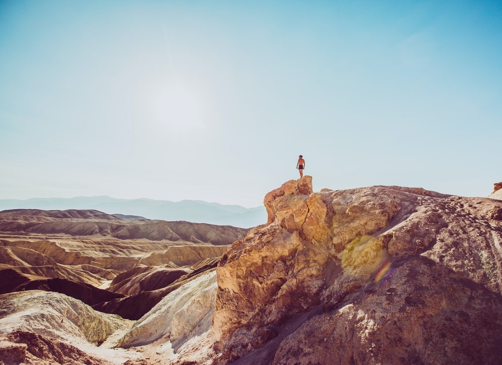 person standing on top of mountain